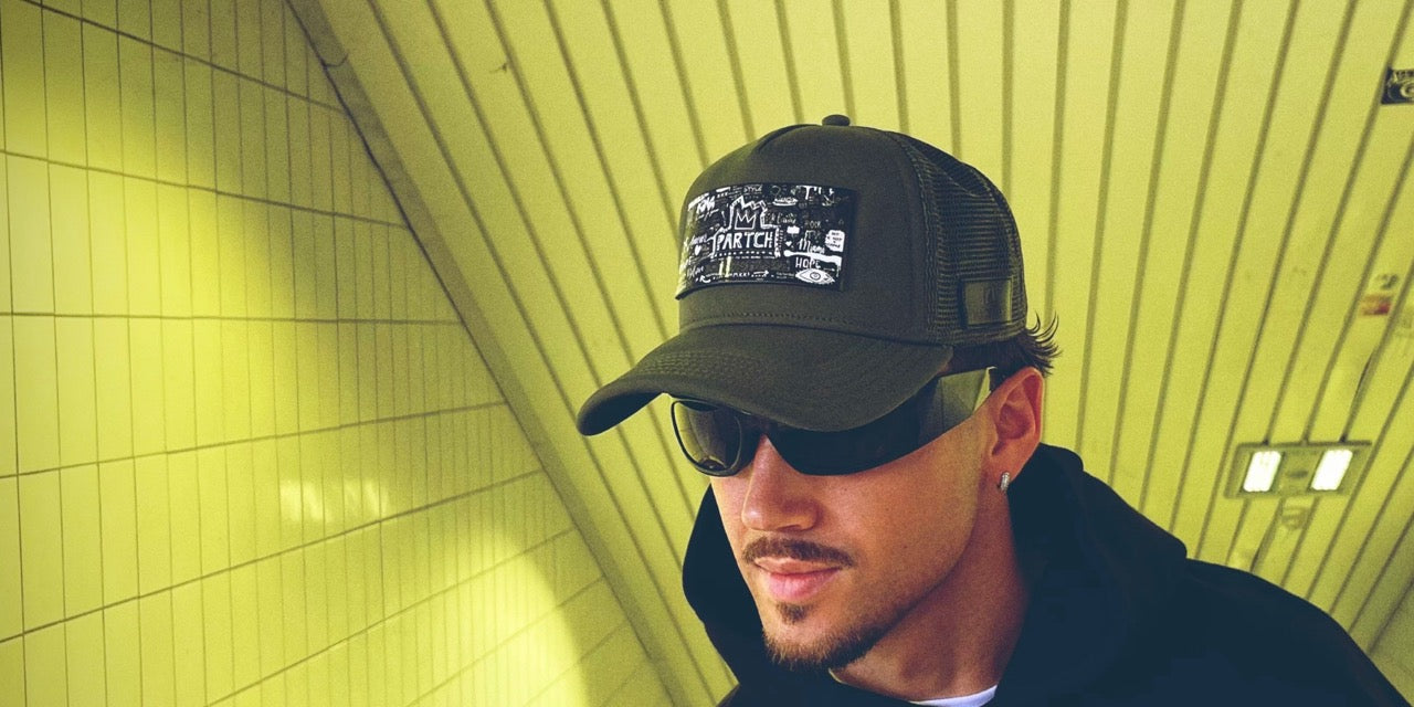 Man wearing a luxury mesh trucker hat by PARTCH