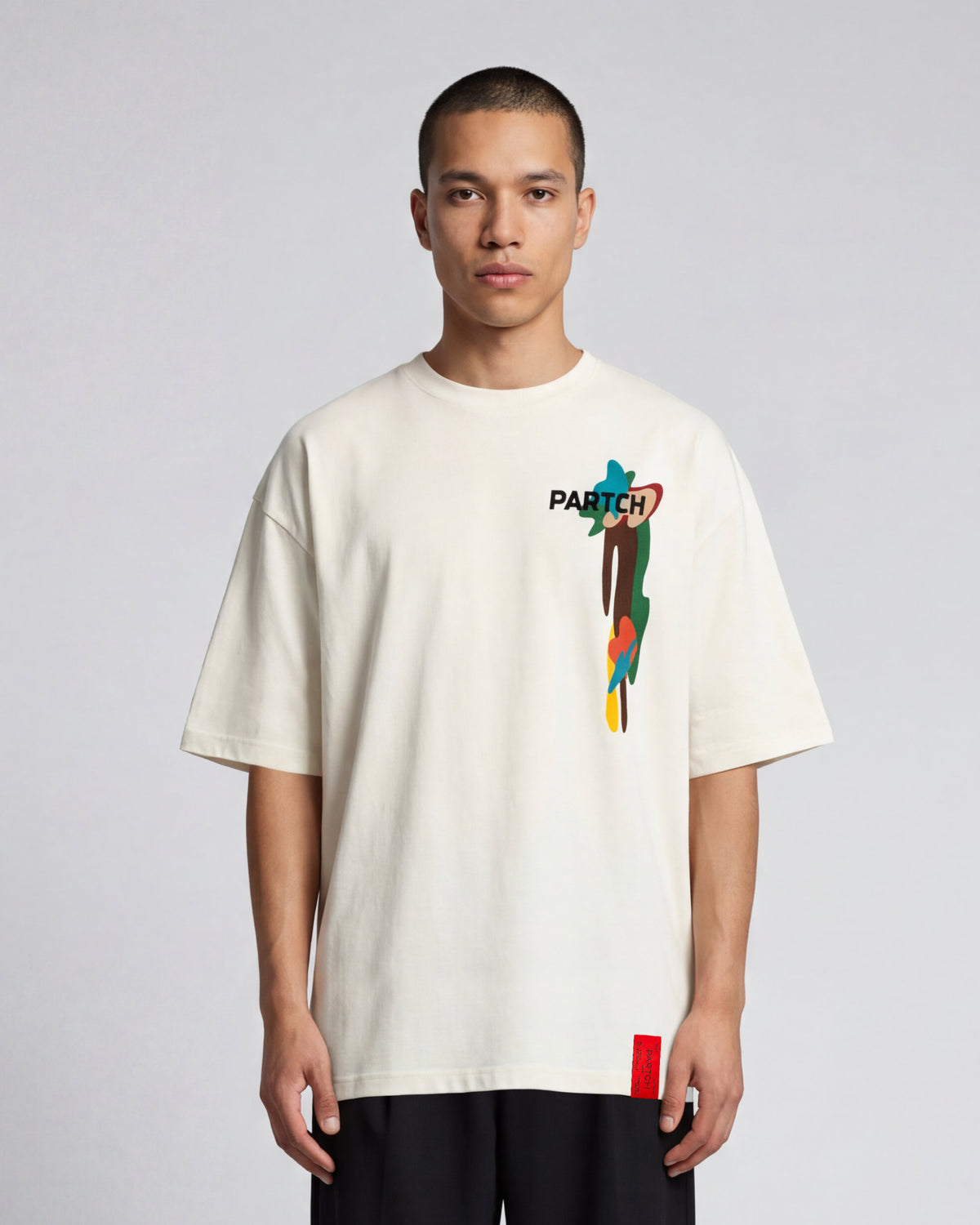 Man Wearing a Drift Graphic PARTCH T-Shirt Oversized t-Shirt Organic Cotton with Black Pant | Elegant Chic Streetwear