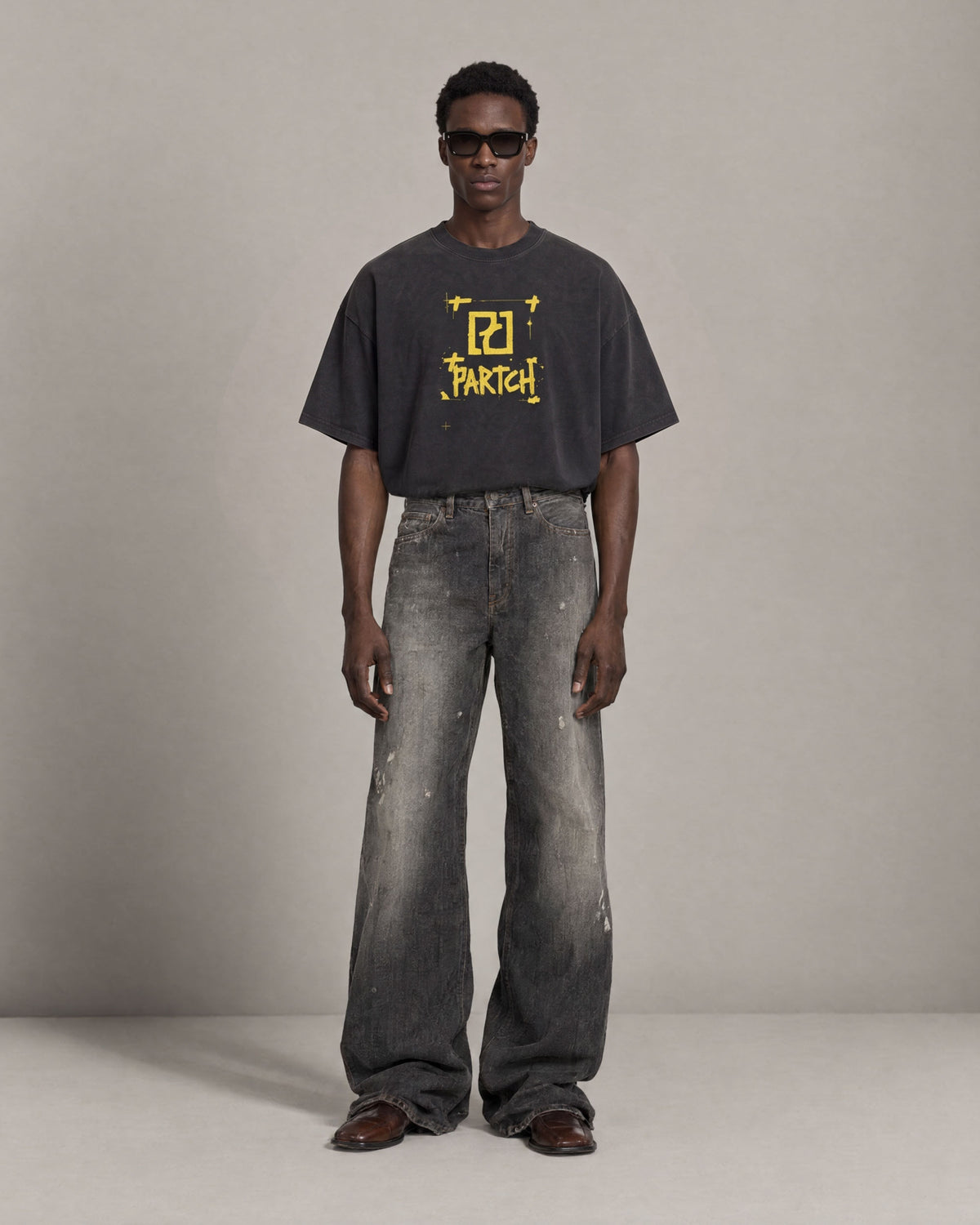 Man wearing luxury vintage black oversized t-shirt Element yellow art graphic | PARTCH