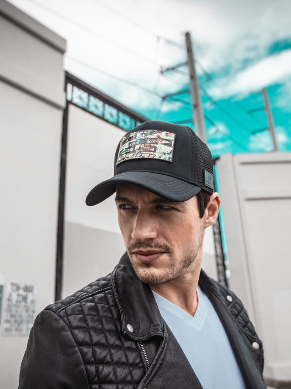 Man Black Leather Jacket and Black New York patch trucker hat