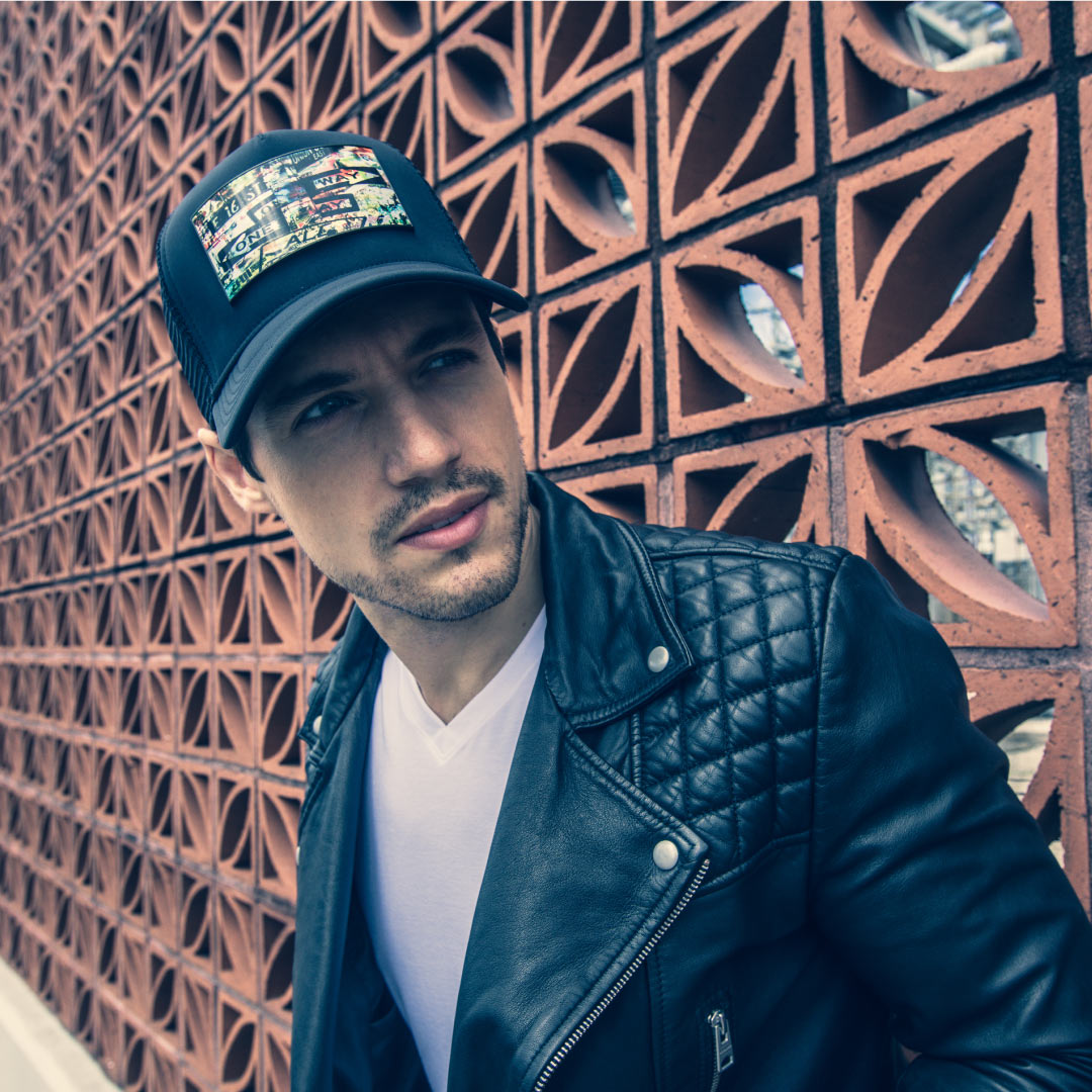 Man genuine leather black jacket and black trucker hat Art New York