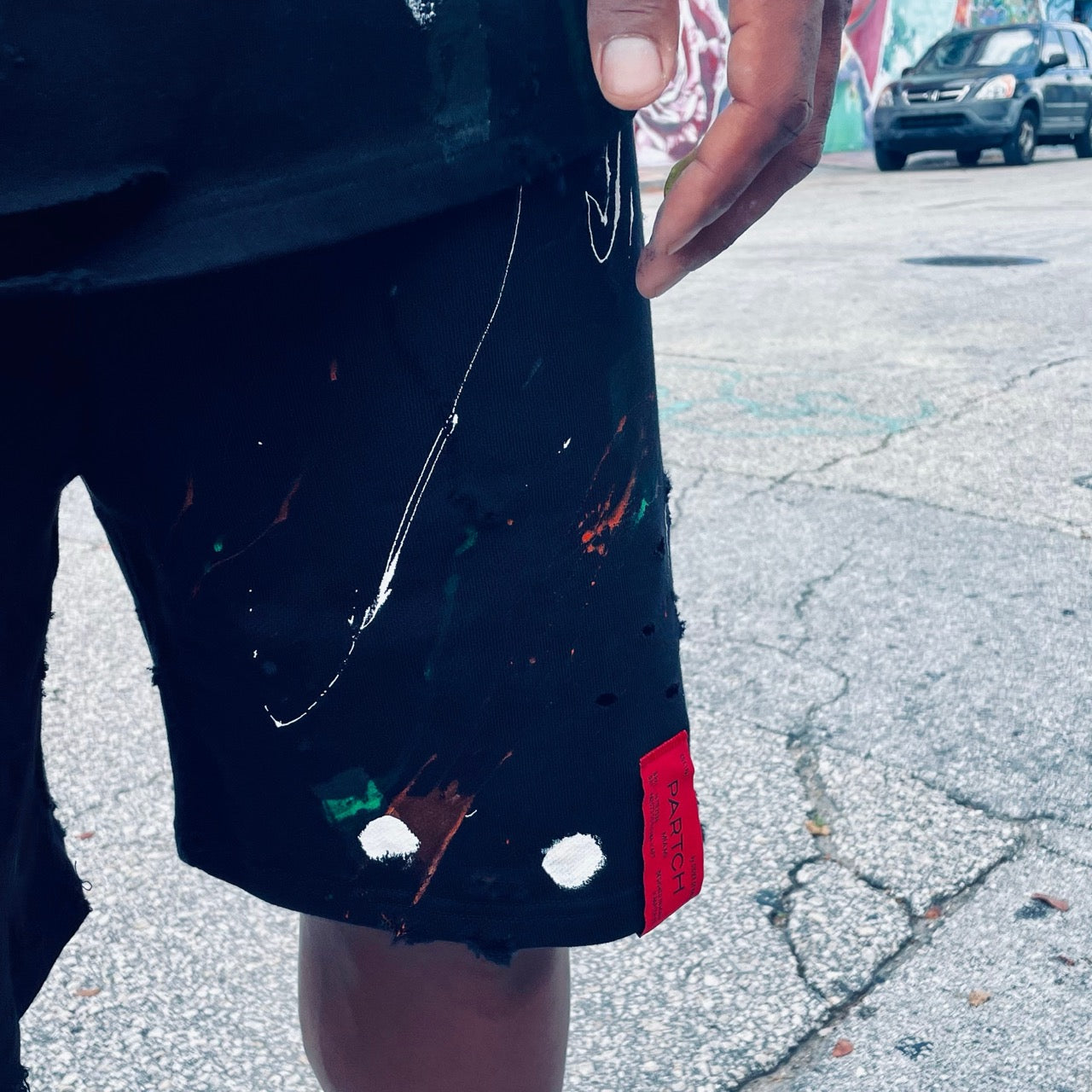 Partch Sweat Short Distressed Hand Painted with Genuine Red Leather Patch | by Didier Devaux