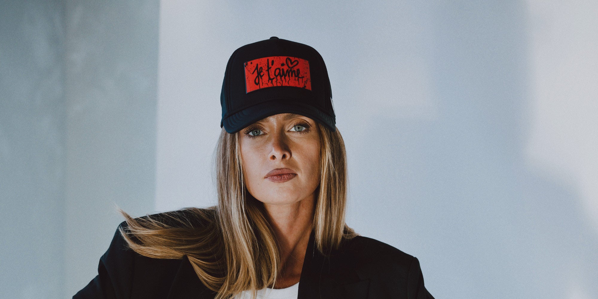 Woman wearing black cap with je t'aime removable Partch-Clip | PARTCH