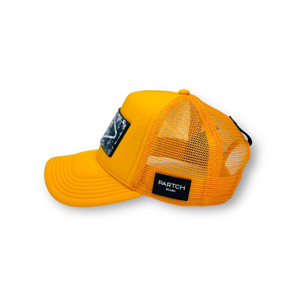 Yellow Partch Trucker Hat in Spandex and breathable rear mesh. 
