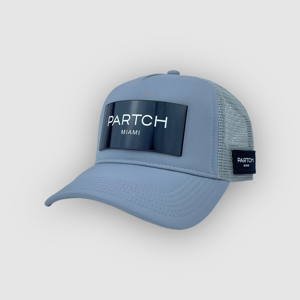 Partch luxury trucker hat in grey  logomania logo 